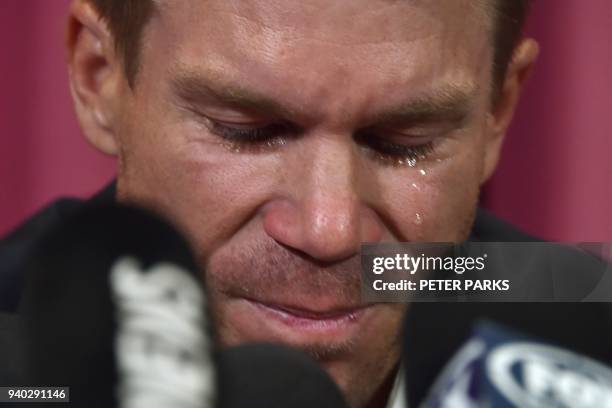 Australian cricketer David Warner cries during a press conference at the Sydney Cricket Ground in Sydney on March 31 after his return from South...