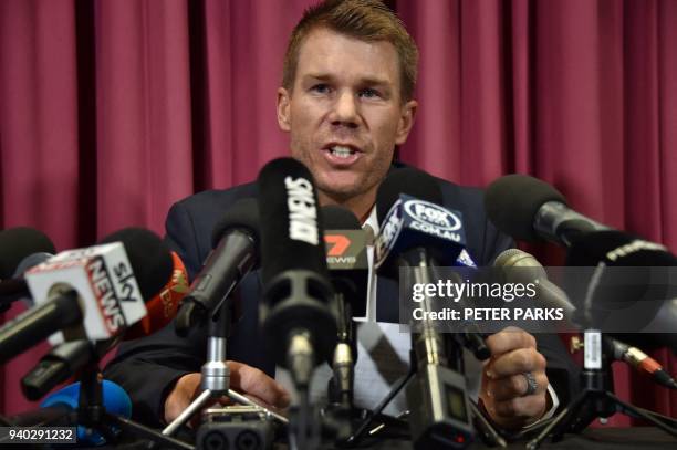 Australian cricketer David Warner speaks at a press conference at the Sydney Cricket Ground in Sydney on March 31 after returning from South Africa....