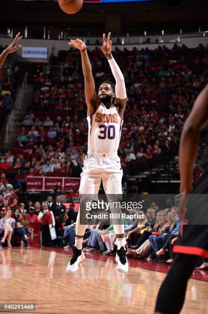 Troy Daniels of the Phoenix Suns shoots the ball against the Houston Rockets on March 30, 2018 at the Toyota Center in Houston, Texas. NOTE TO USER:...