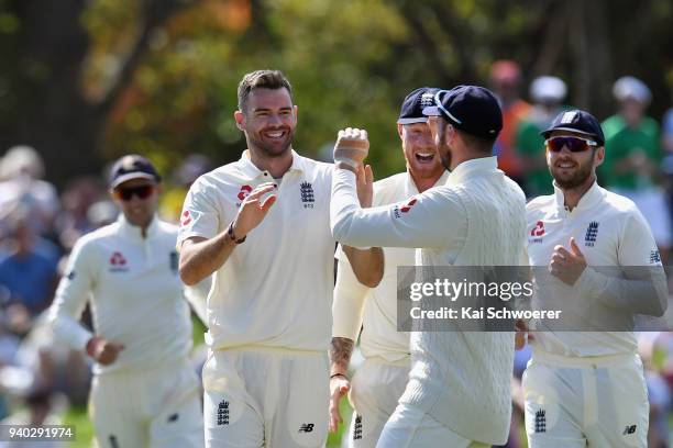 James Anderson of England is congratulated by team mates after dismissing Kane Williamson of New Zealand during day two of the Second Test match...