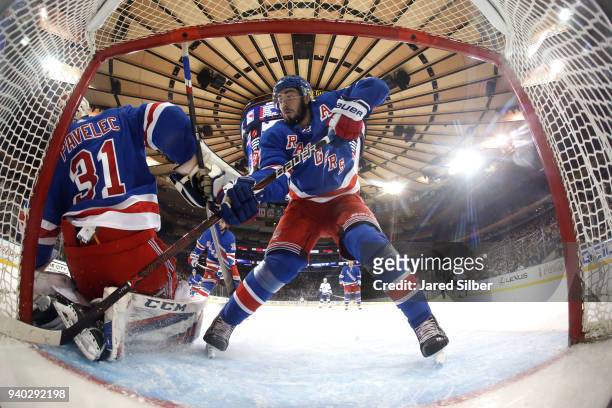 Mika Zibanejad of the New York Rangers defends against the Tampa Bay Lightning at Madison Square Garden on March 30, 2018 in New York City.