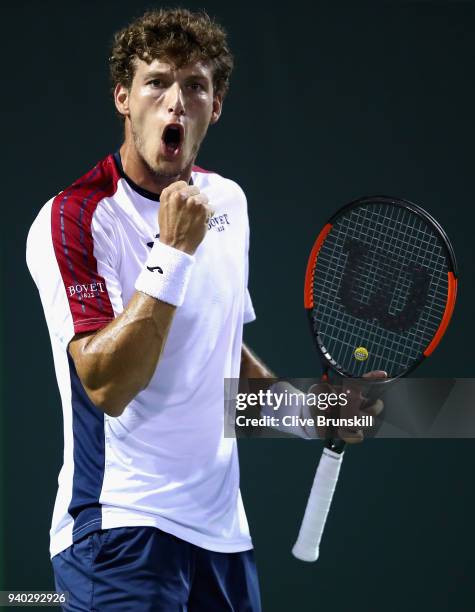 Pablo Carreno Busta of Spain celebrates a point against Alexander Zverev of Germany in their semifinal match during the Miami Open Presented by Itau...