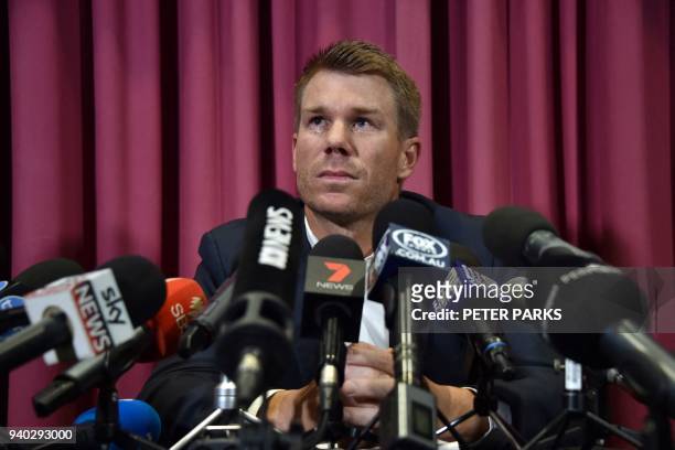 Australian cricketer David Warner listens to a question at a press conference at the Sydney Cricket Ground in Sydney on March 31 after returning from...