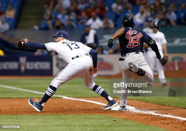 First baseman Brad Miller of the Tampa Bay Rays hauls in the throw from shortstop Adeiny Hechavarria to complete the double play with the out on...