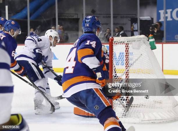 Auston Matthews of the Toronto Maple Leafs scores at 16:02 of the third period against Christopher Gibson of the New York Islanders at the Barclays...
