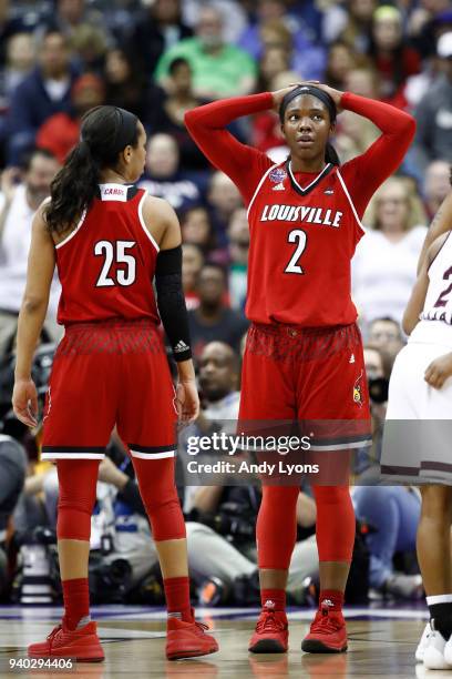 Asia Durr and Myisha Hines-Allen of the Louisville Cardinals react late in the game against the Mississippi State Lady Bulldogs in the semifinals of...