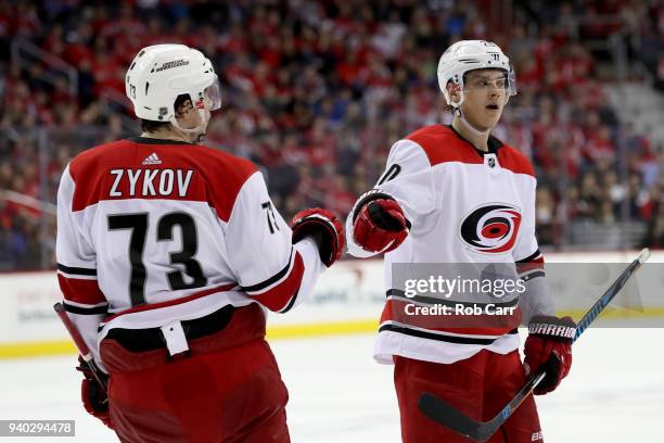 Sebastian Aho of the Carolina Hurricanes celebrates with Valentin Zykov after scoring a third period goal against the Washington Capitals at Capital...