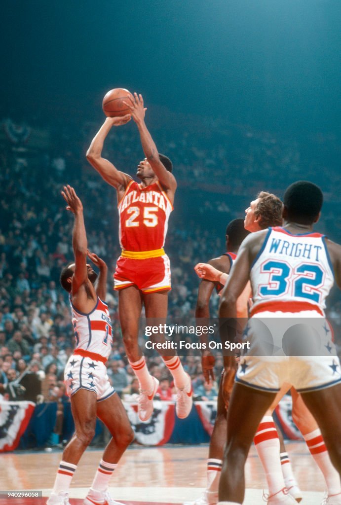 Terry Furlow of the Atlanta Hawks shoots over Charles Johnson of the