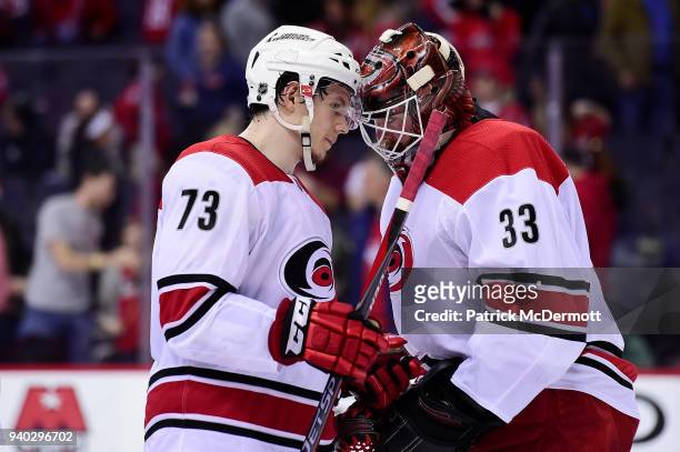 Scott Darling and Valentin Zykov of the Carolina Hurricanes celebrate after the Hurricanes defeated the Washington Capitals 4-1 at Capital One Arena...