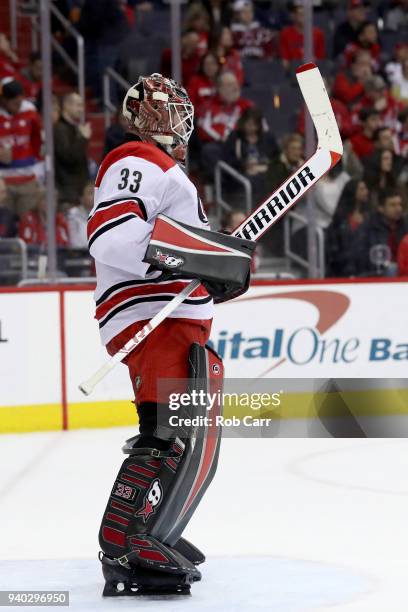 Goalie Scott Darling of the Carolina Hurricanes follows the puck in the second period against the Washington Capitals at Capital One Arena on March...