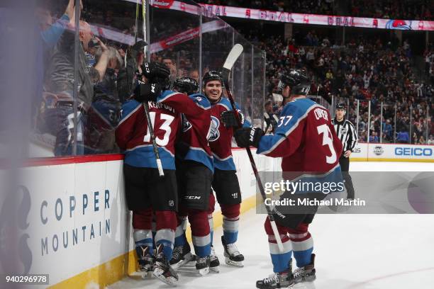 Compher, Alexander Kerfoot, Nail Yakupov and Samuel Girard of the Colorado Avalanche celebrate a goal by teammate Sven Andrighetto against the...