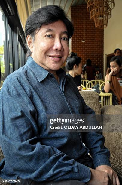 This picture taken on March 30, 2018 shows Indonesian artist Muhammad Guruh Irianto Sukarnoputra posing during a promotional event in Jakarta....