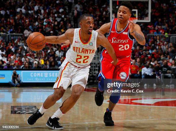 Isaiah Taylor of the Atlanta Hawks drives against Markelle Fultz of the Philadelphia 76ers at Philips Arena on March 30, 2018 in Atlanta, Georgia....