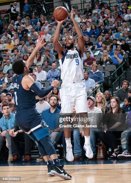 Aaron Harrison of the Dallas Mavericks shoots the ball against the Minnesota Timberwolves on March 30, 2018 at the American Airlines Center in...