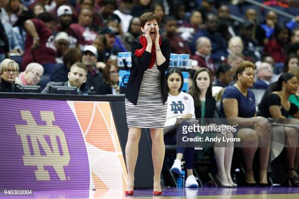 Head coach Muffet McGraw of the Notre Dame Fighting Irish instructs her team against the Connecticut Huskies during the first half in the semifinals...