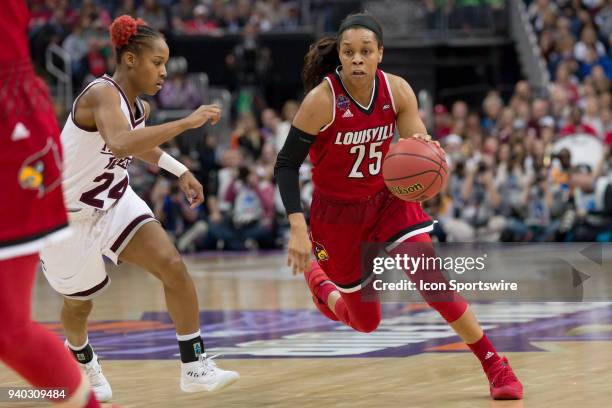 Louisville Cardinals guard Asia Durr drives into the lane in the division I women's championship semifinal game between the Louisville Cardinals and...