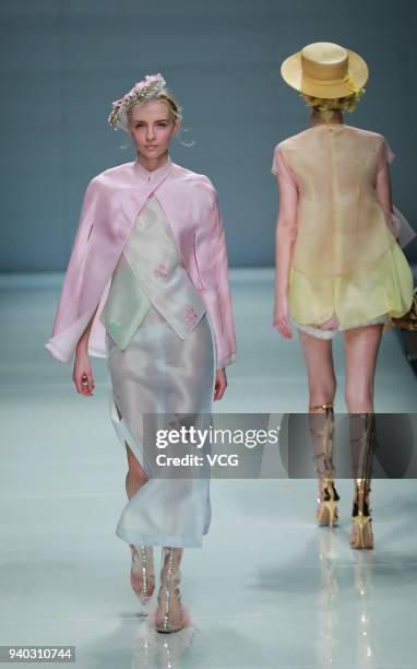 Model showcases designs on the runway at Moliere show by designer Sunhong Qianmei on day five of Mercedes-Benz China Fashion Week Autumn/Winter...