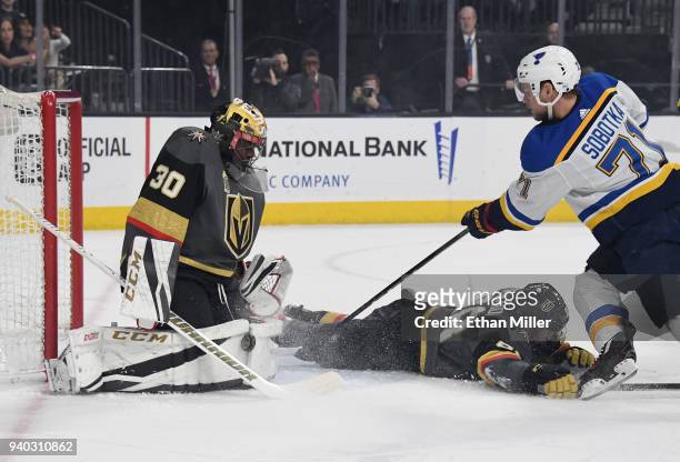 Malcolm Subban of the Vegas Golden Knights blocks a shot by Vladimir Sobotka of the St. Louis Blues as Nate Schmidt of the Golden Knights dives in...