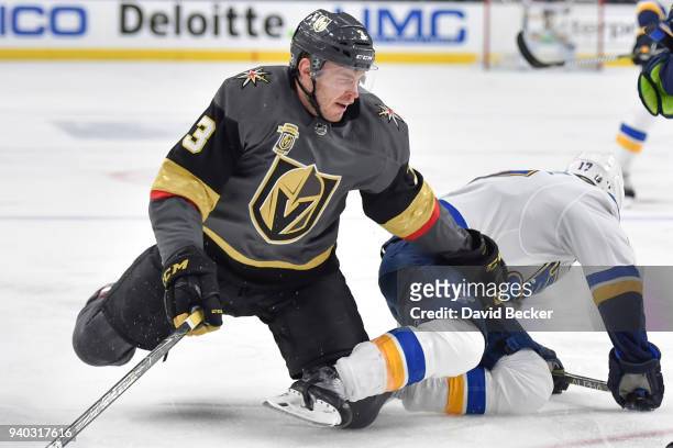 Brayden McNabb of the Vegas Golden Knights collides with Jaden Schwartz of the St. Louis Blues during the game at T-Mobile Arena on March 30, 2018 in...