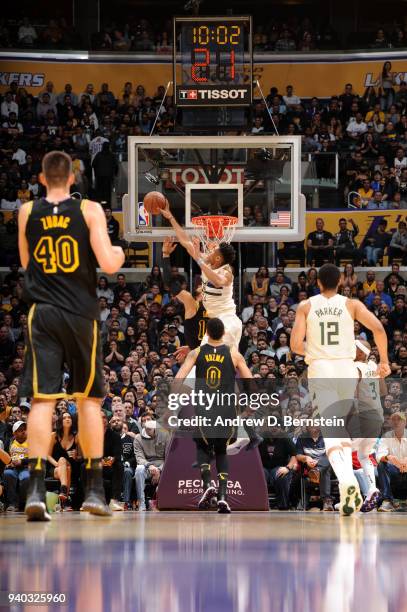 Giannis Antetokounmpo of the Milwaukee Bucks blocks the shot by Tyler Ennis of the Los Angeles Lakers during the game between the two teams on March...