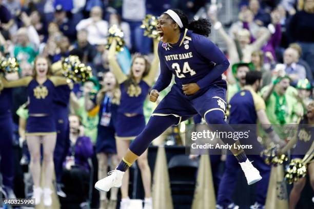 Arike Ogunbowale of the Notre Dame Fighting Irish celebrates her game winning basket with one second left in overtime against the Connecticut Huskies...