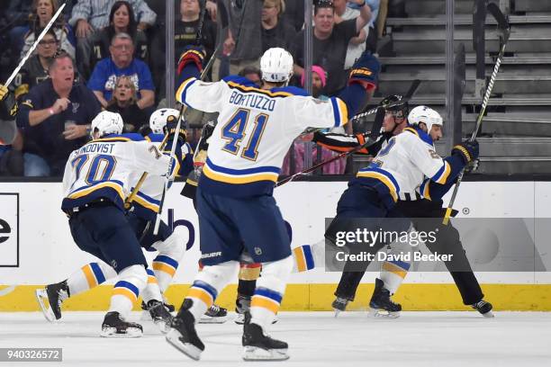 Chris Thorburn celebrates his goal with teammates Oskar Sundqvist and Robert Bortuzzo of the St. Louis Blues against the Vegas Golden Knights during...