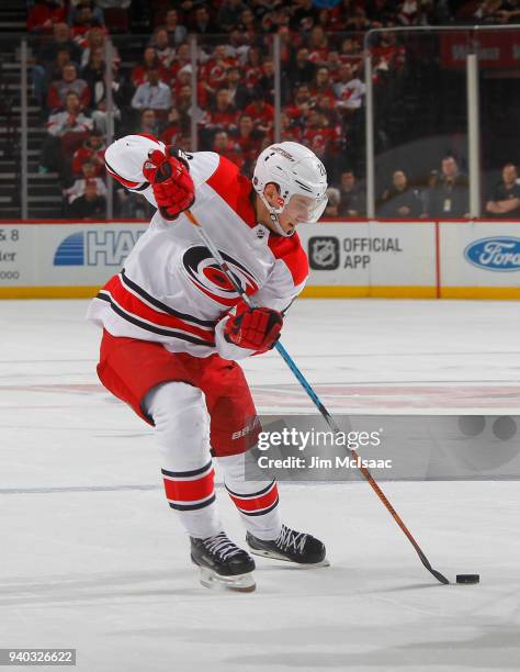 Sebastian Aho of the Carolina Hurricanes in action against the New Jersey Devils on March 27, 2018 at Prudential Center in Newark, New Jersey. The...