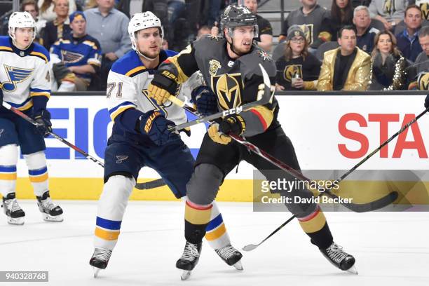 Vladimir Sobotka of the St. Louis Blues defends Shea Theodore of the Vegas Golden Knights during the game at T-Mobile Arena on March 30, 2018 in Las...