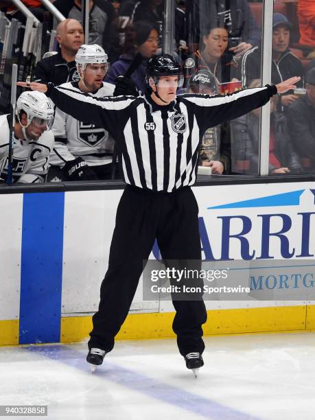 Official Shane Heyer works in his final career NHL game during a game played between the Los Angeles Kings and the Anaheim Ducks played on March 30,...