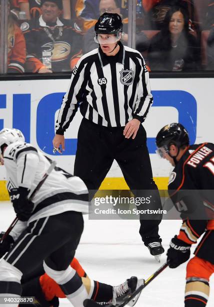 Official Shane Heyer works in his final career NHL game during a game played between the Los Angeles Kings and the Anaheim Ducks played on March 30,...