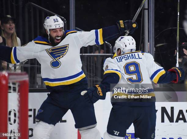 Chris Thorburn and Scottie Upshall of the St. Louis Blues celebrate after Upshall assisted Thorburn on a third-period goal against the Vegas Golden...