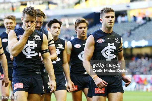 Marc Murphy of the Blues leads the team out after defeat during the round two AFL match between the Carlton Blues and the Gold Coast Suns at Etihad...