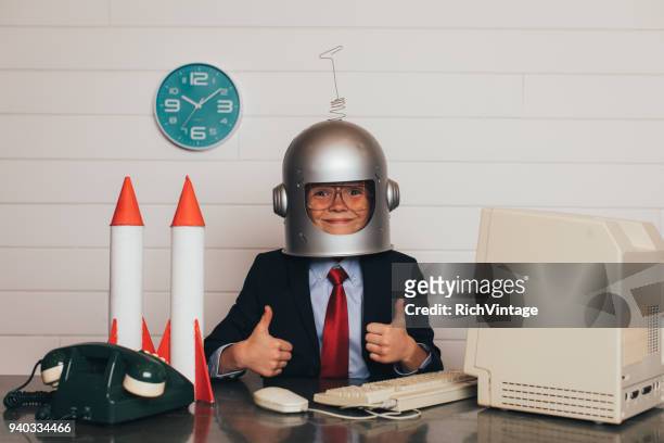 young business boy with space helmet and rockets - child in space suit stock pictures, royalty-free photos & images
