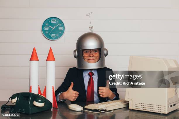 young business boy with space helmet and rockets - astronaut imagens e fotografias de stock