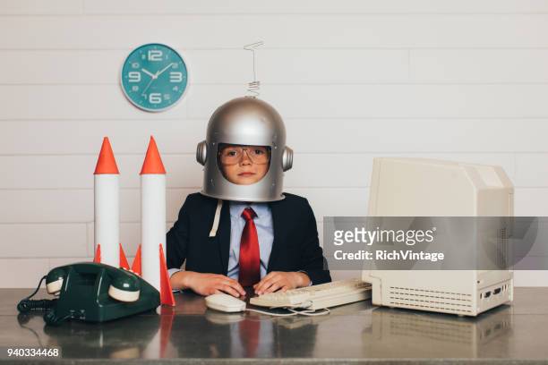 young business boy with space helmet and rockets - rocket scientist stock pictures, royalty-free photos & images