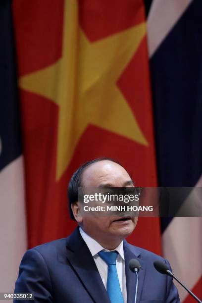 Vietnam's Prime Minister Nguyen Xuan Phuc delivers a speech after the Greater Mekong Subregion Summit in Hanoi on March 31, 2018. / AFP PHOTO / POOL...
