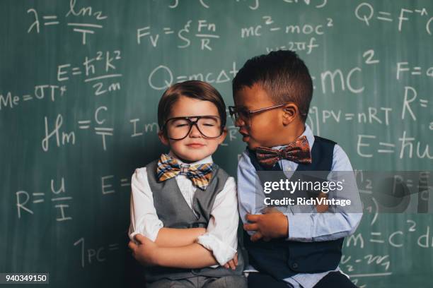 young retro nerd boys telling secrets in class - teachers pet stock pictures, royalty-free photos & images