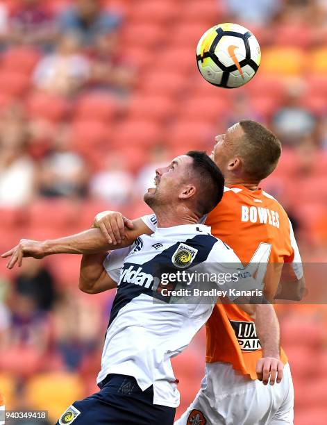Daniel Bowles of the Roar is pressured by the defence during the round 25 A-League match between the Brisbane Roar and the Central Coast Mariners at...