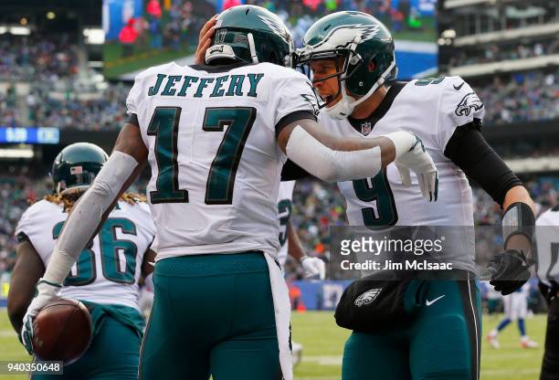 Nick Foles and Alshon Jeffery of the Philadelphia Eagles in action against the New York Giants on December 17, 2017 at MetLife Stadium in East...
