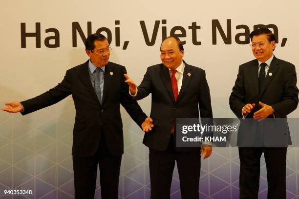 Cambodia's Prime Minister Hun Sen , Vietnam's Prime Minister Nguyen Xuan Phuc and Laos' Prime Minister Thongloun Sisoulith pose for a photo before...
