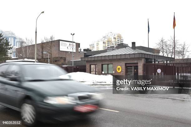 Car passes in front of a building of the German embassy in Moscow on March 31, 2018. Russia on March 29, 2018 announced a mass expulsion of US...