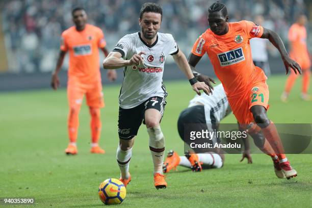 Gokhan Gonul of Besiktas in action against Fabrice NSakala of Aytemiz Alanyaspor during a Turkish Super Lig week 27 soccer match between Besiktas and...