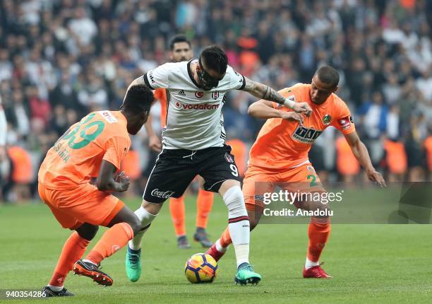 Alvaro Negredo of Besiktas in action against Welinton Souza of Aytemiz Alanyaspor during a Turkish Super Lig week 27 soccer match between Besiktas...