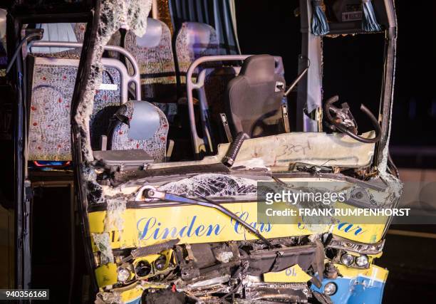 Heavily damaged bus is pictured after a crash with a truck on the Autobahn 3 motorway on March 31 in Waldaschaff, near Aschaffenburg in Bavaria,...
