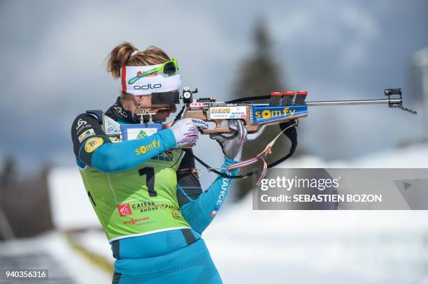 French Anais Bescond shoots during the biathlon mass start on March 31 in Premanon. / AFP PHOTO / SEBASTIEN BOZON