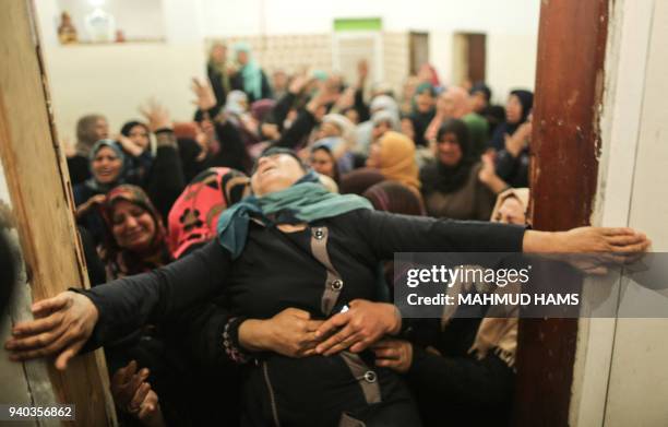 Palestinian relative of Hamdan Abu Amsha, who was killed a day earlier by Israeli forces when clashes erupted as tens of thousands as Gazans marched...
