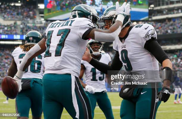 Nick Foles and Alshon Jeffery of the Philadelphia Eagles in action against the New York Giants on December 17, 2017 at MetLife Stadium in East...