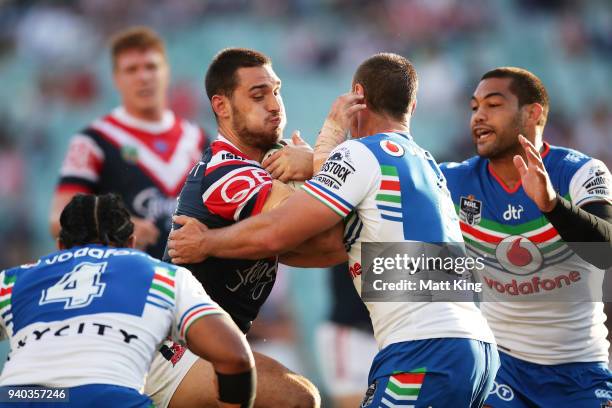 Ryan Matterson of the Roosters is tackled during the round four NRL match between the Sydney Roosters and the New Zealand Warriors at Allianz Stadium...