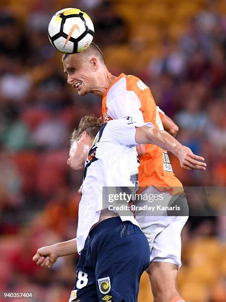 Daniel Bowles of the Roar gets above the defence during the round 25 A-League match between the Brisbane Roar and the Central Coast Mariners at...