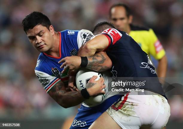 Issac Luke of the Warriors is tackled by Luke Keary of the Roosters during the round four NRL match between the Sydney Roosters and the New Zealand...